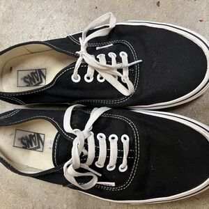 Black Vans.